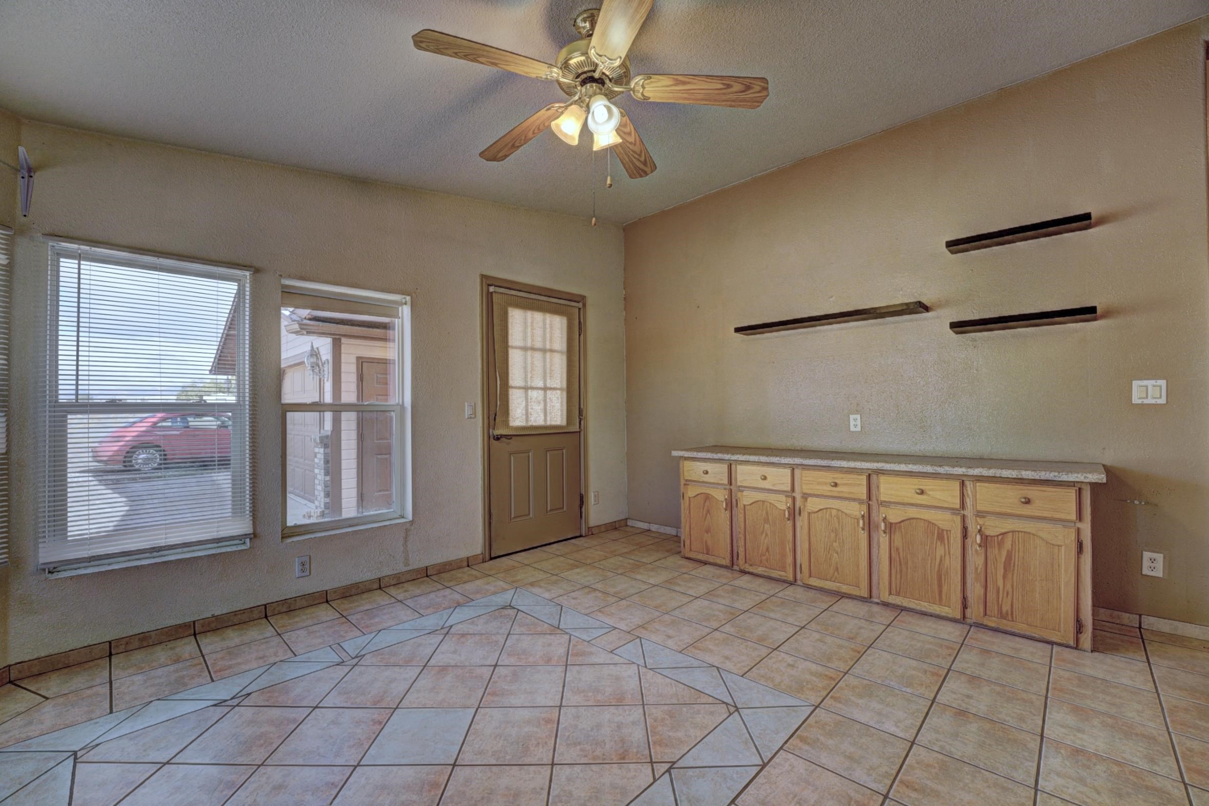 694-29 29 1/2 Road Grand Junction, CO 81504 - Photo 13 of 27 a view of an empty room with window and cabinet