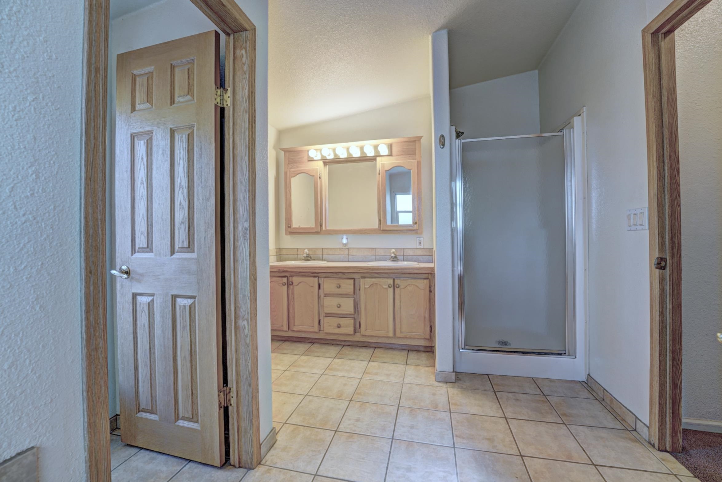 694-29 29 1/2 Road Grand Junction, CO 81504 - Photo 15 of 27 a bathroom with a double vanity sink and mirror