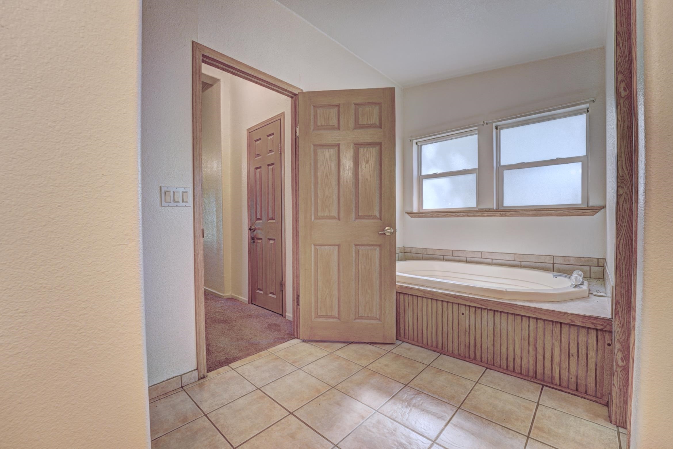 694-29 29 1/2 Road Grand Junction, CO 81504 - Photo 16 of 27 a bathroom with a bathtub and a shower