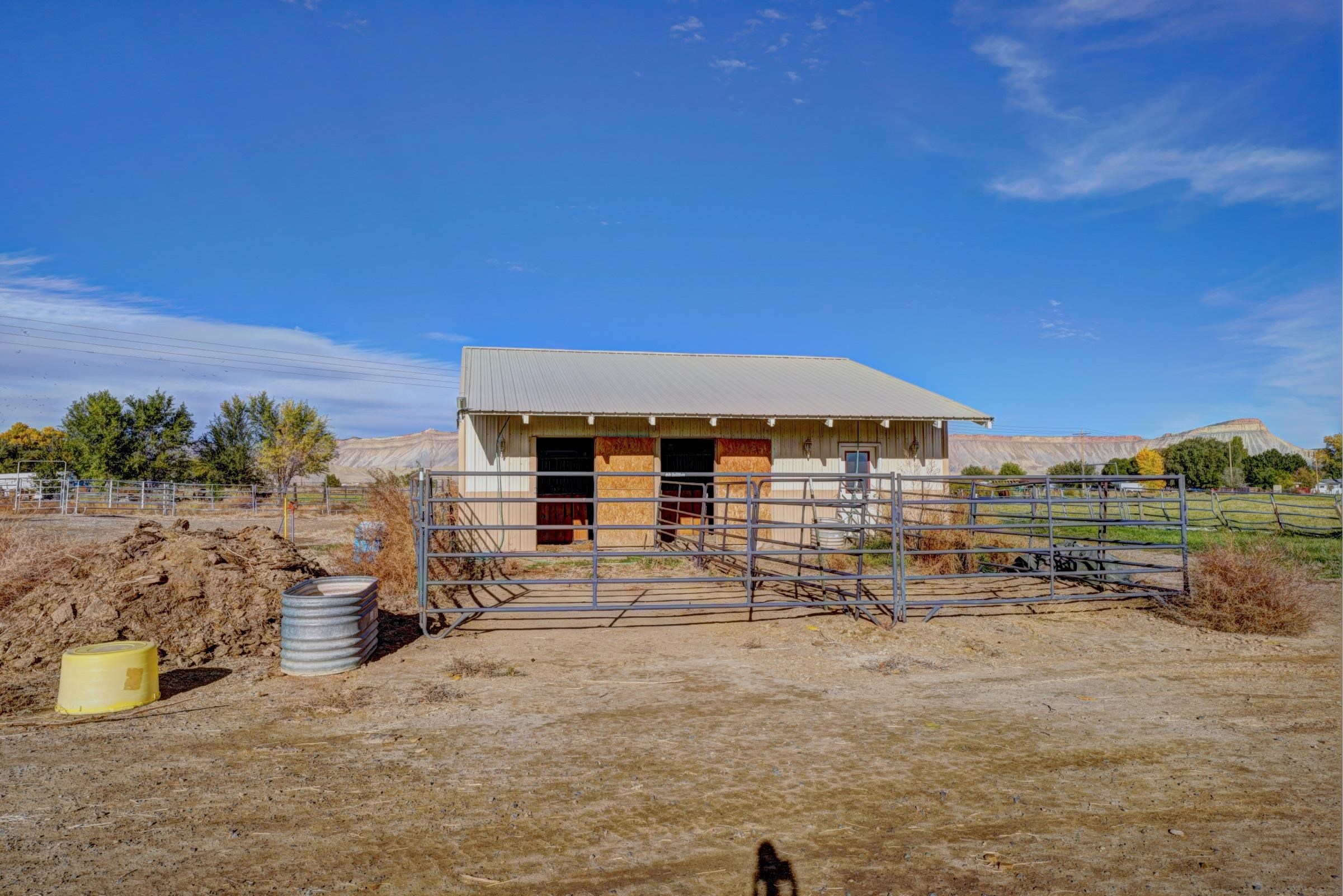 694-29 29 1/2 Road Grand Junction, CO 81504 - Photo 22 of 27 a view of a house with a yard