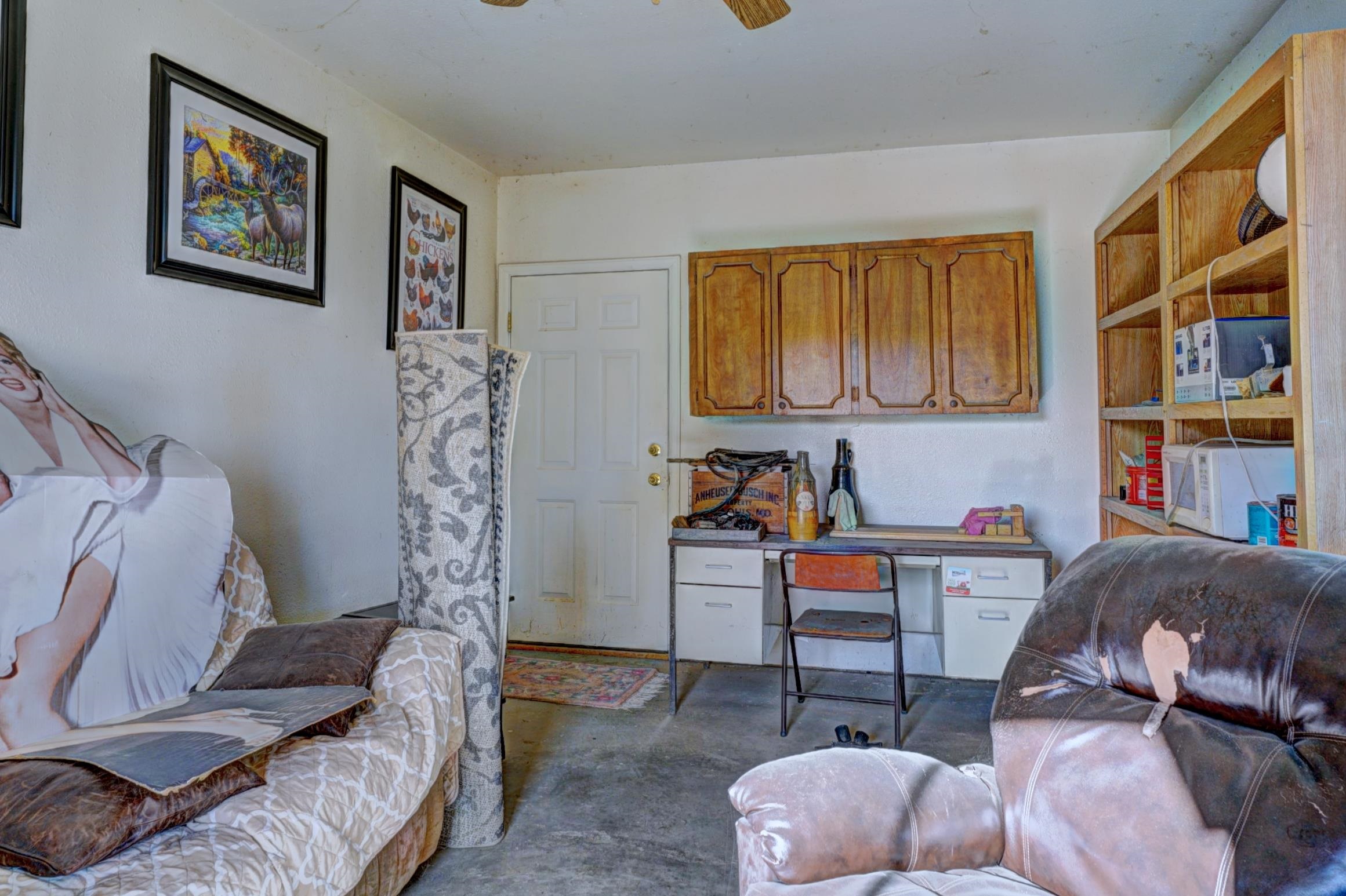 694-29 29 1/2 Road Grand Junction, CO 81504 - Photo 23 of 27 a living room with furniture and a book shelf