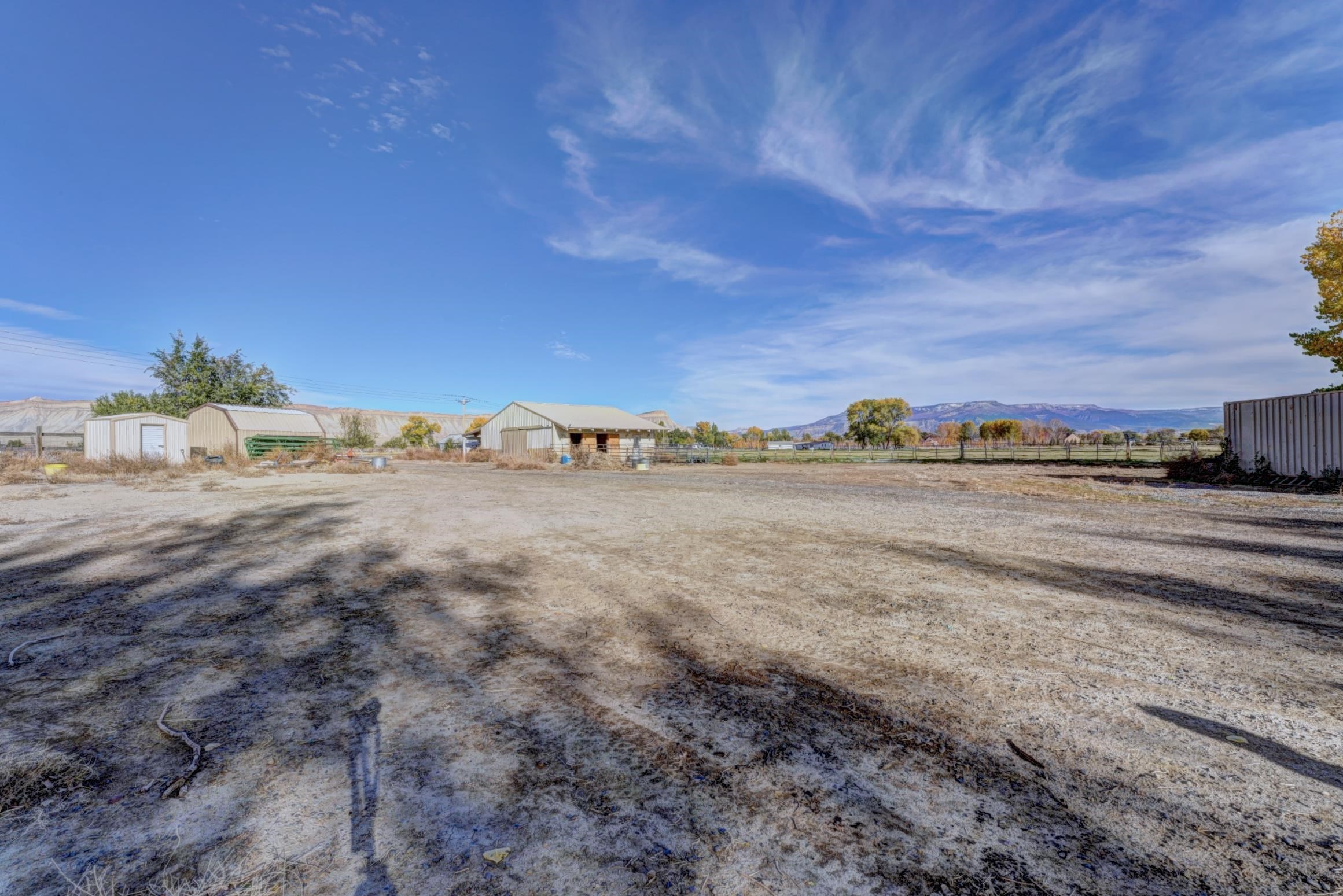 694-29 29 1/2 Road Grand Junction, CO 81504 - Photo 24 of 27 a view of a dry yard with wooden fence