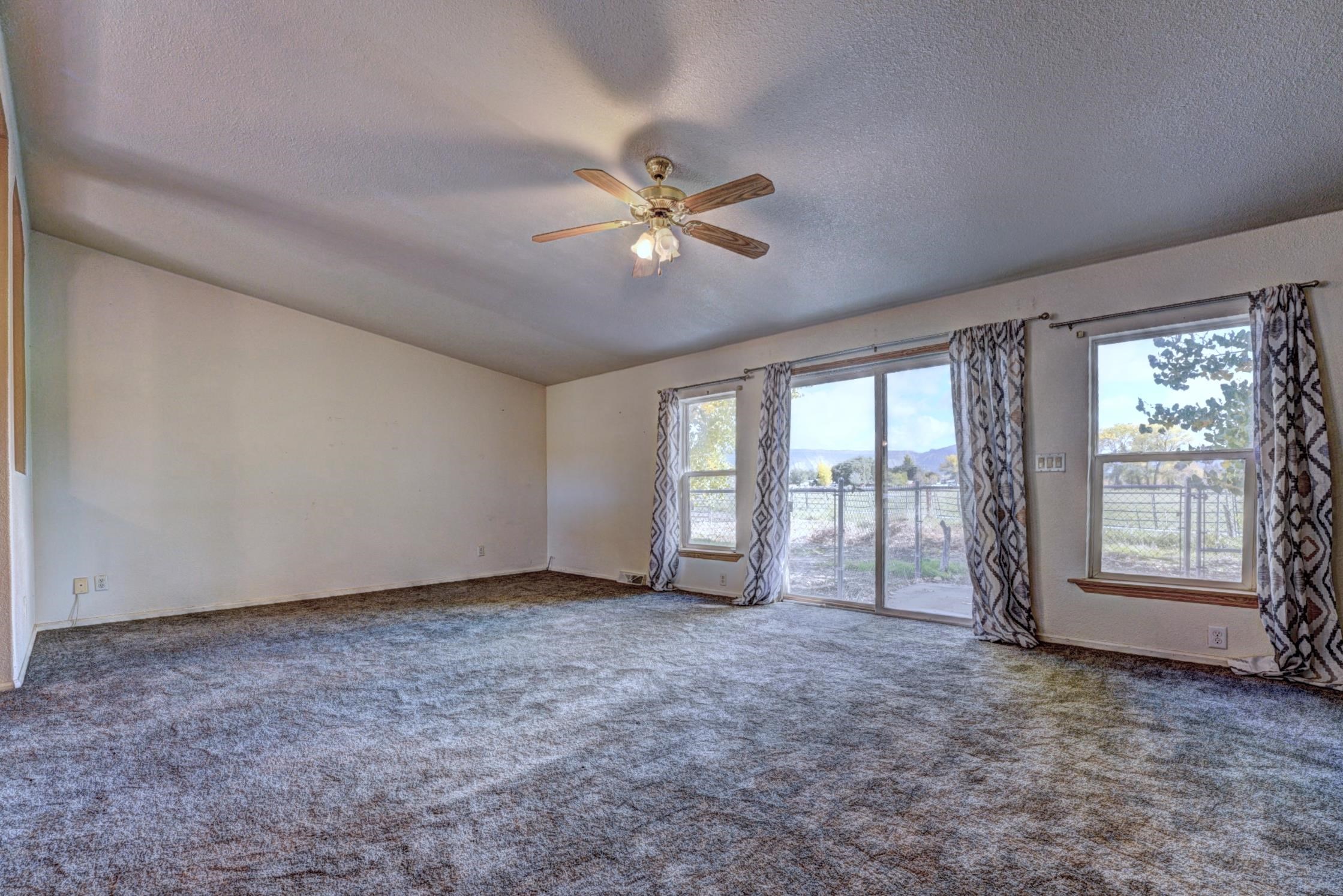 694-29 29 1/2 Road Grand Junction, CO 81504 - Photo 5 of 27 a view of an empty room with a window