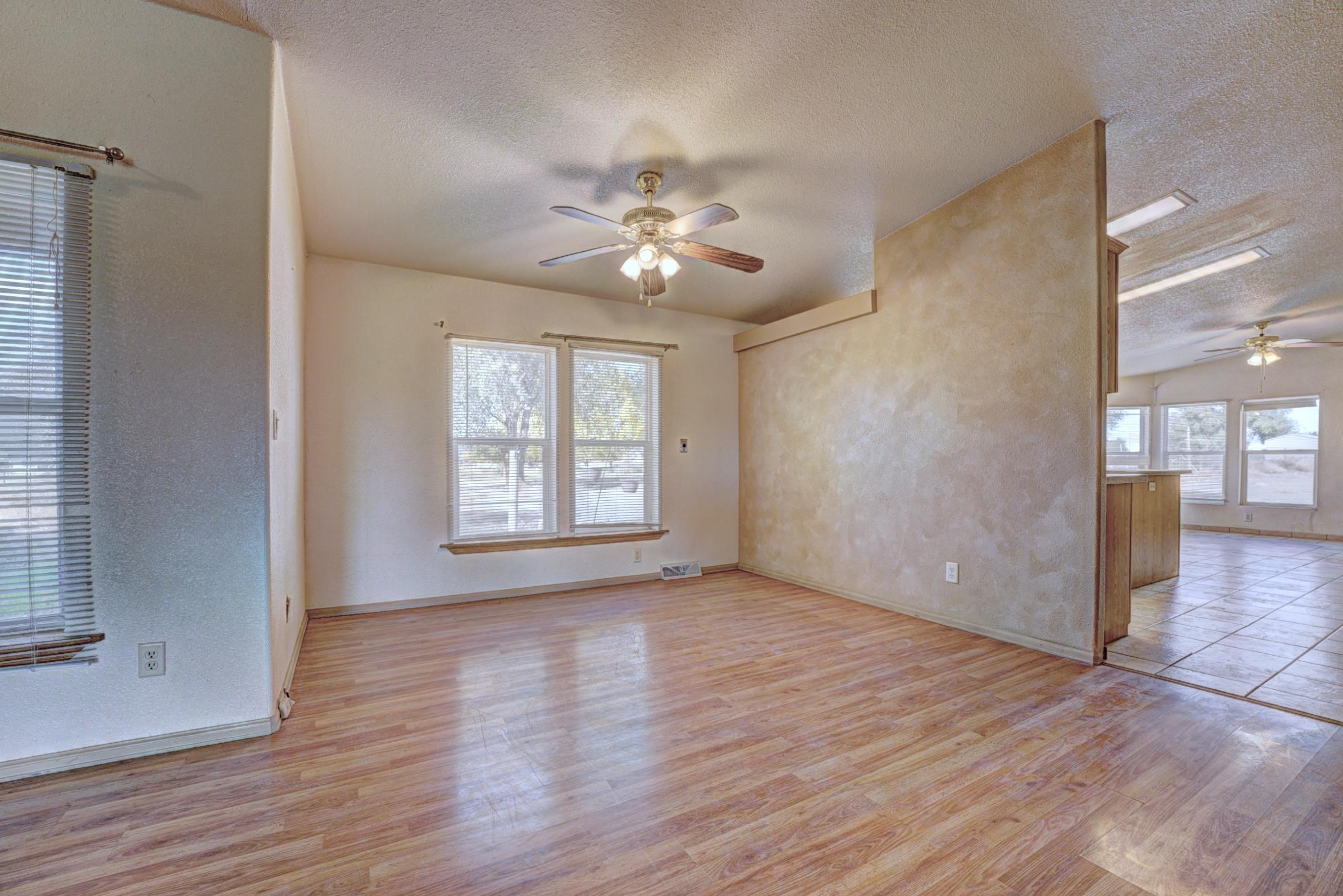 694-29 29 1/2 Road Grand Junction, CO 81504 - Photo 7 of 27 a view of an empty room with window and wooden floor