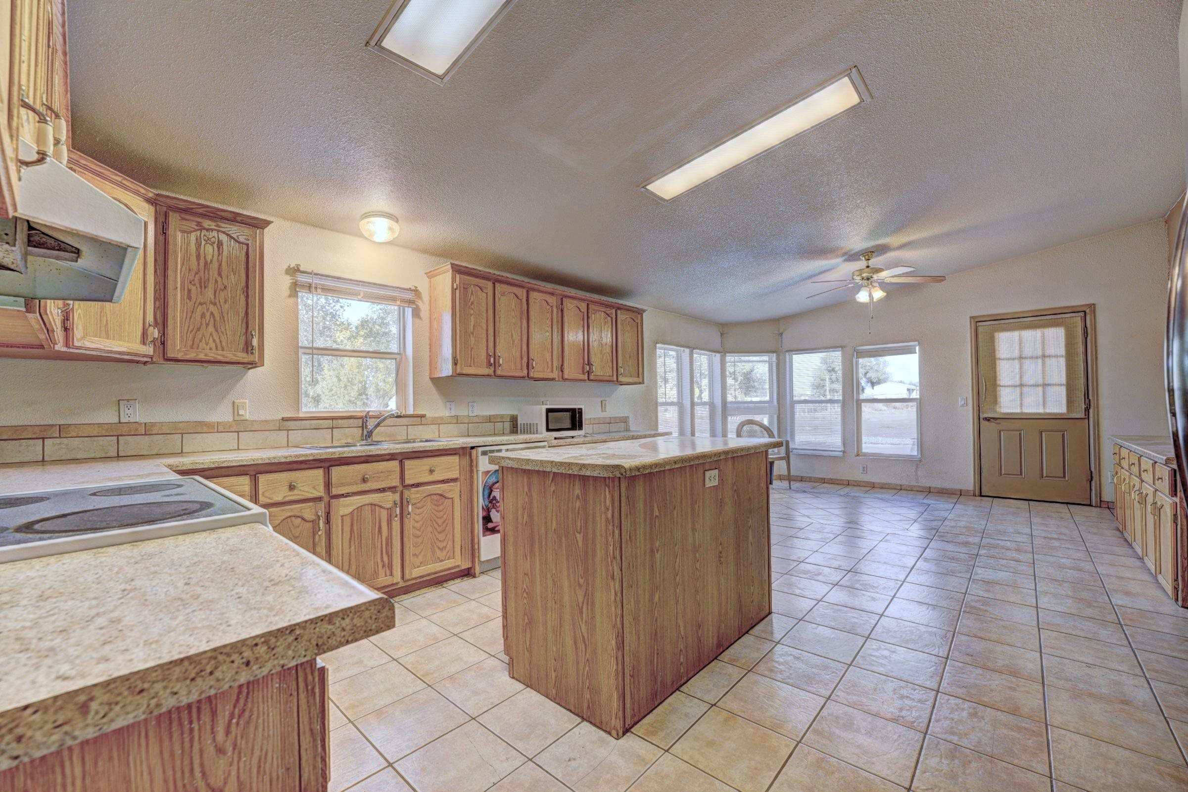 694-29 29 1/2 Road Grand Junction, CO 81504 - Photo 10 of 27 a kitchen with stainless steel appliances granite countertop a sink counter space cabinets and a sink