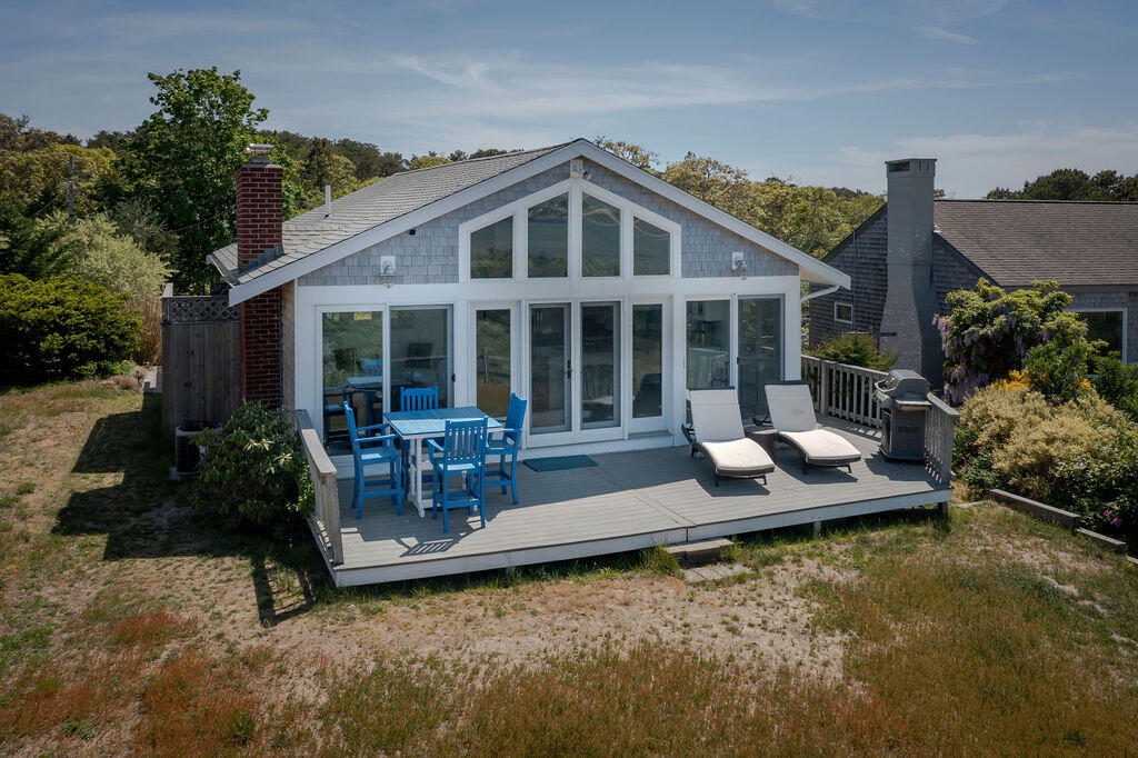 30 Ione Road Wellfleet, MA 02667 - Photo 54 of 56 a view of a house with backyard porch and sitting area