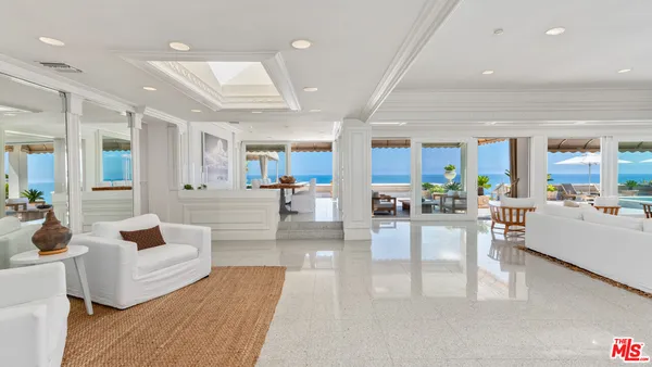 a kitchen with stainless steel appliances granite countertop a sink and a stove