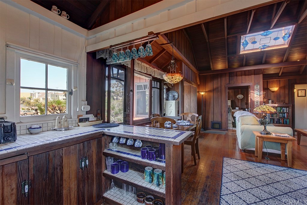 310 Hawthorne Road Laguna Beach, CA 92651 - Photo 11 of 25 a view of a dining room with furniture window and wooden floor