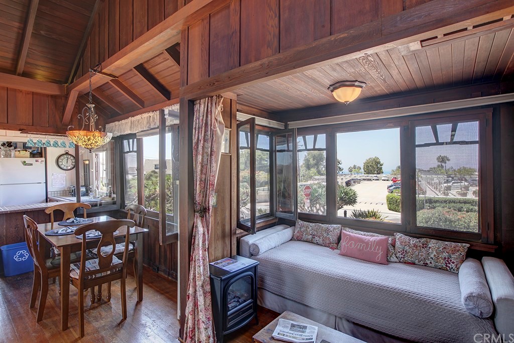 310 Hawthorne Road Laguna Beach, CA 92651 - Photo 10 of 25 a living room with furniture and a floor to ceiling window