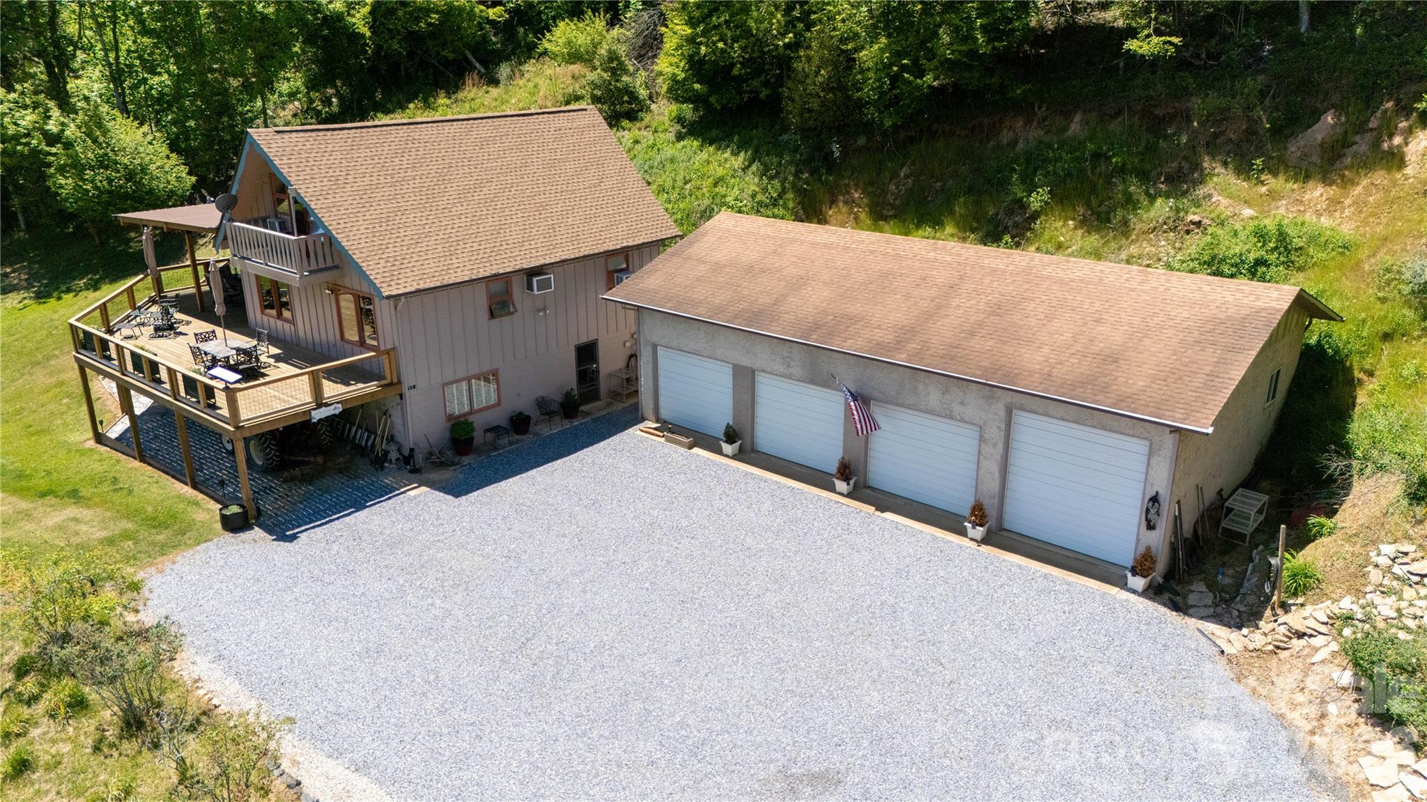 93 Franklin Crest Road Spruce Pine, NC 28777 - Photo 6 of 47 an aerial view of a house with table and chairs