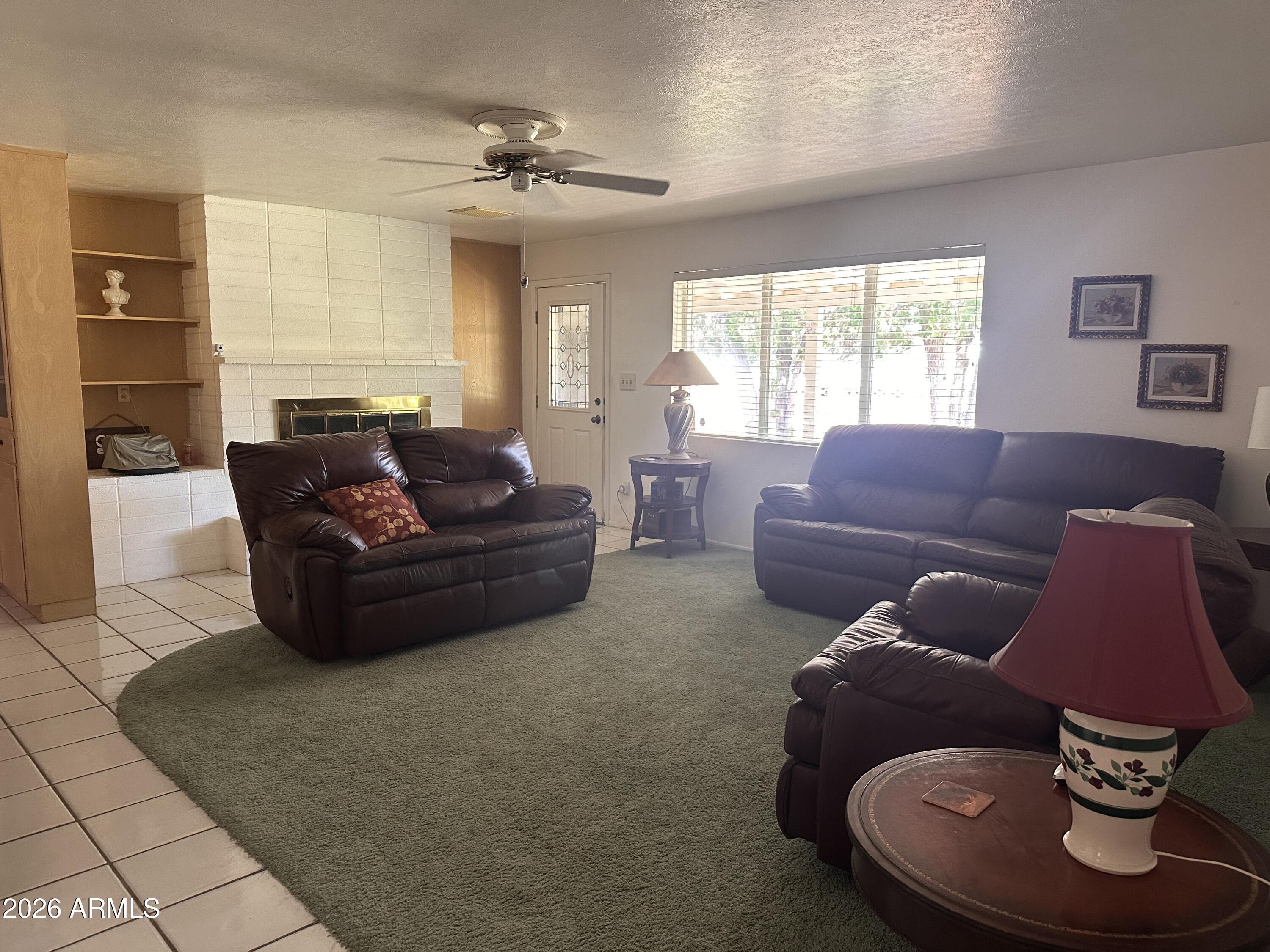 2821 West Elliot Road Laveen, AZ 85339 - Photo 11 of 92 a living room with furniture and a large window