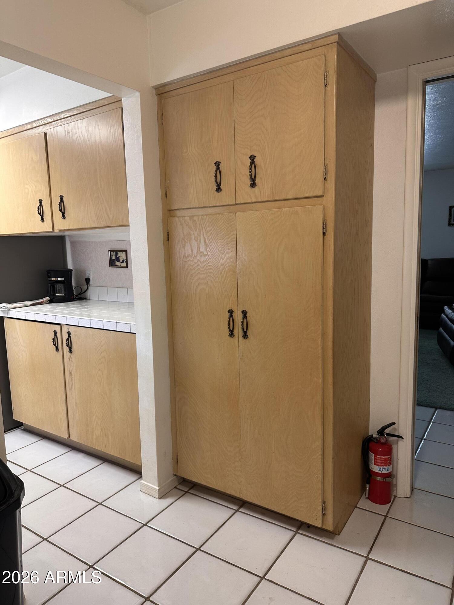 2821 West Elliot Road Laveen, AZ 85339 - Photo 19 of 92 a view of a refrigerator and utility room