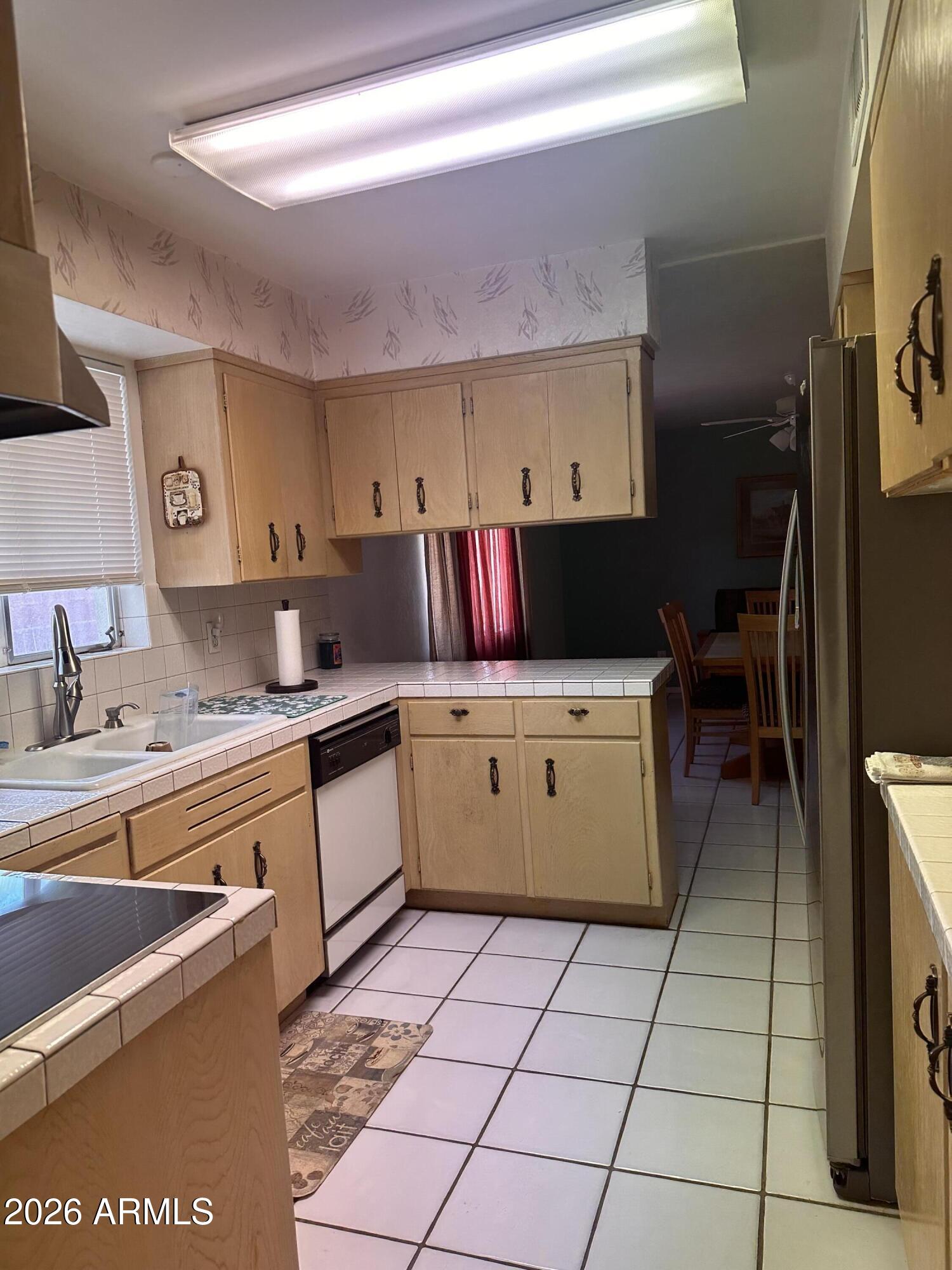 2821 West Elliot Road Laveen, AZ 85339 - Photo 20 of 92 a kitchen with a cabinets and counter space