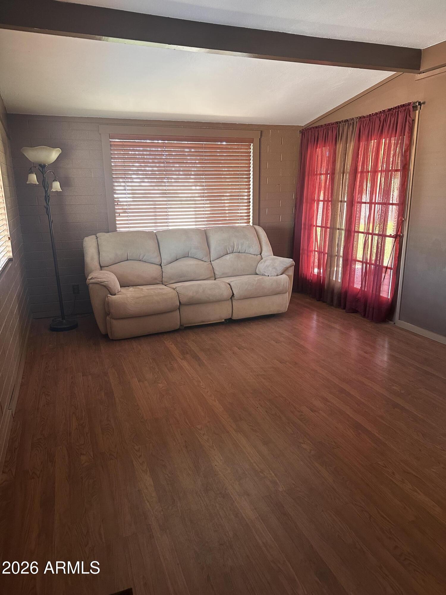 2821 West Elliot Road Laveen, AZ 85339 - Photo 27 of 92 a living room with furniture and a large window