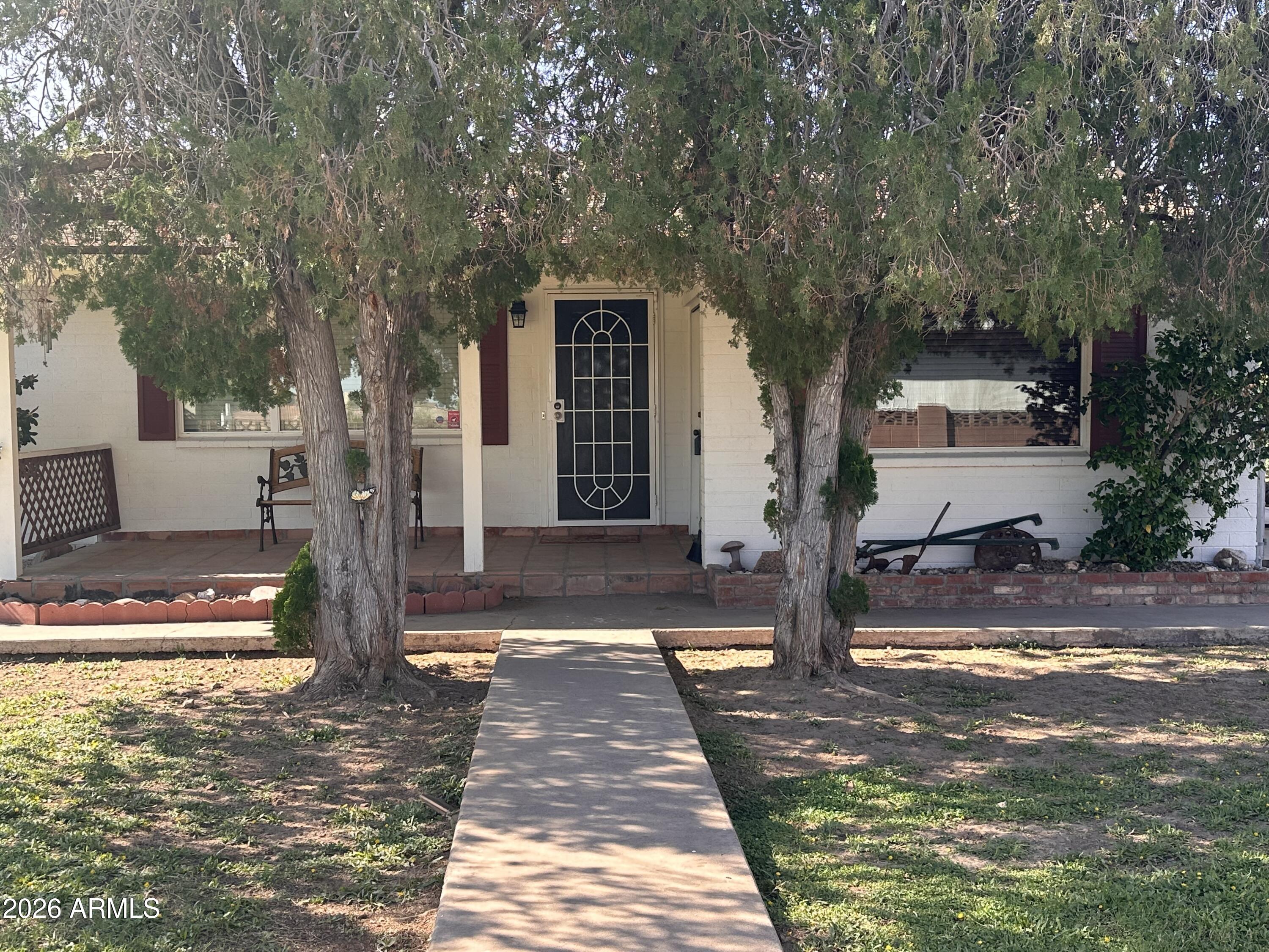 2821 West Elliot Road Laveen, AZ 85339 - Photo 4 of 92 a front view of a house with a yard