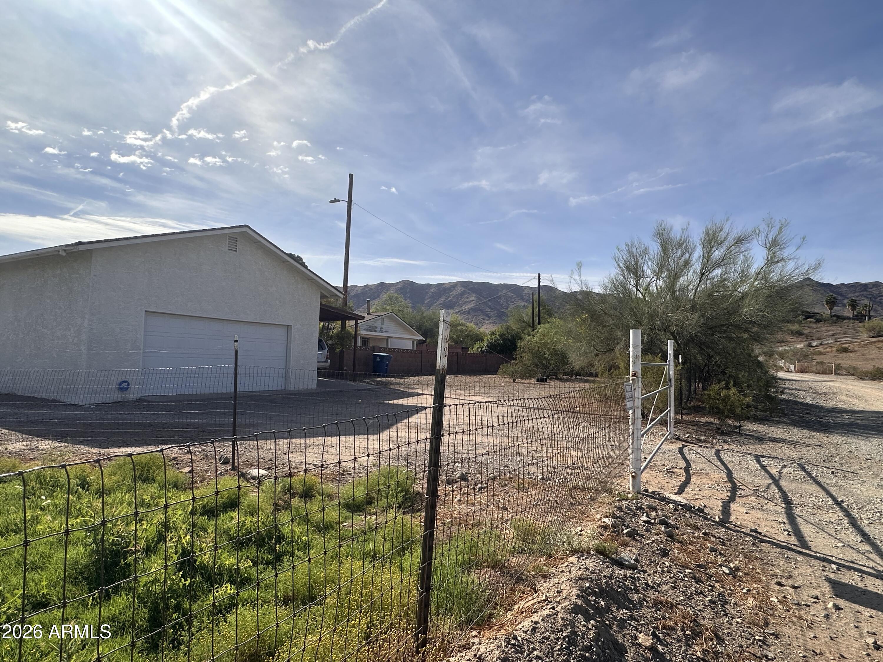 2821 West Elliot Road Laveen, AZ 85339 - Photo 48 of 92 a house view with a backyard space