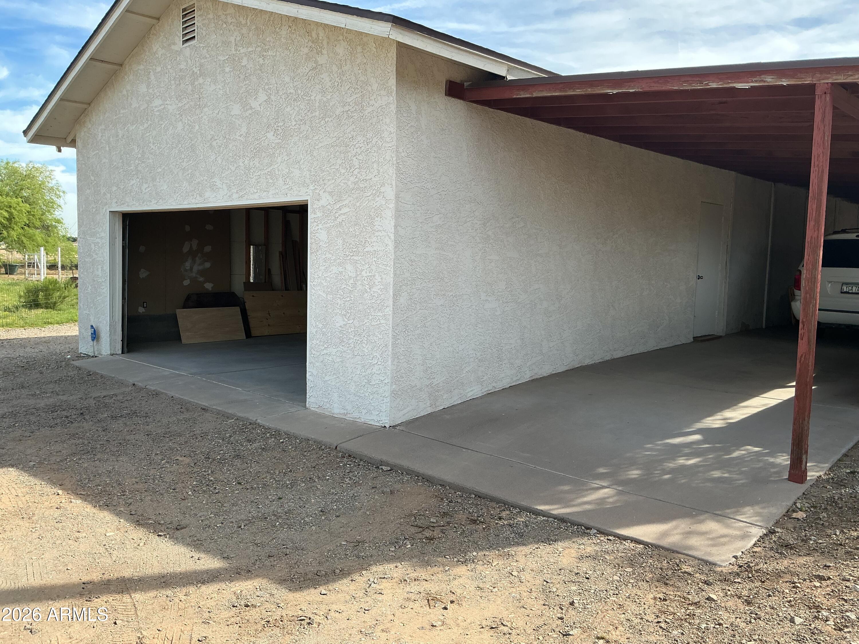 2821 West Elliot Road Laveen, AZ 85339 - Photo 52 of 92 a view of an empty room with a fireplace