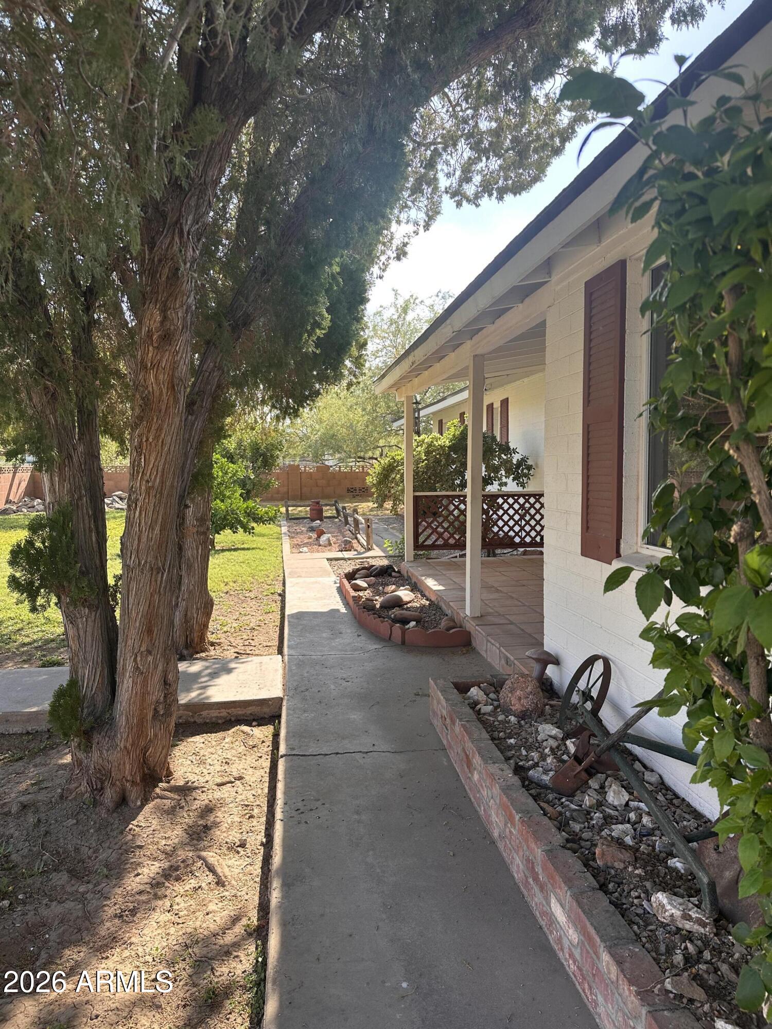 2821 West Elliot Road Laveen, AZ 85339 - Photo 69 of 92 a view of a backyard with garden and patio