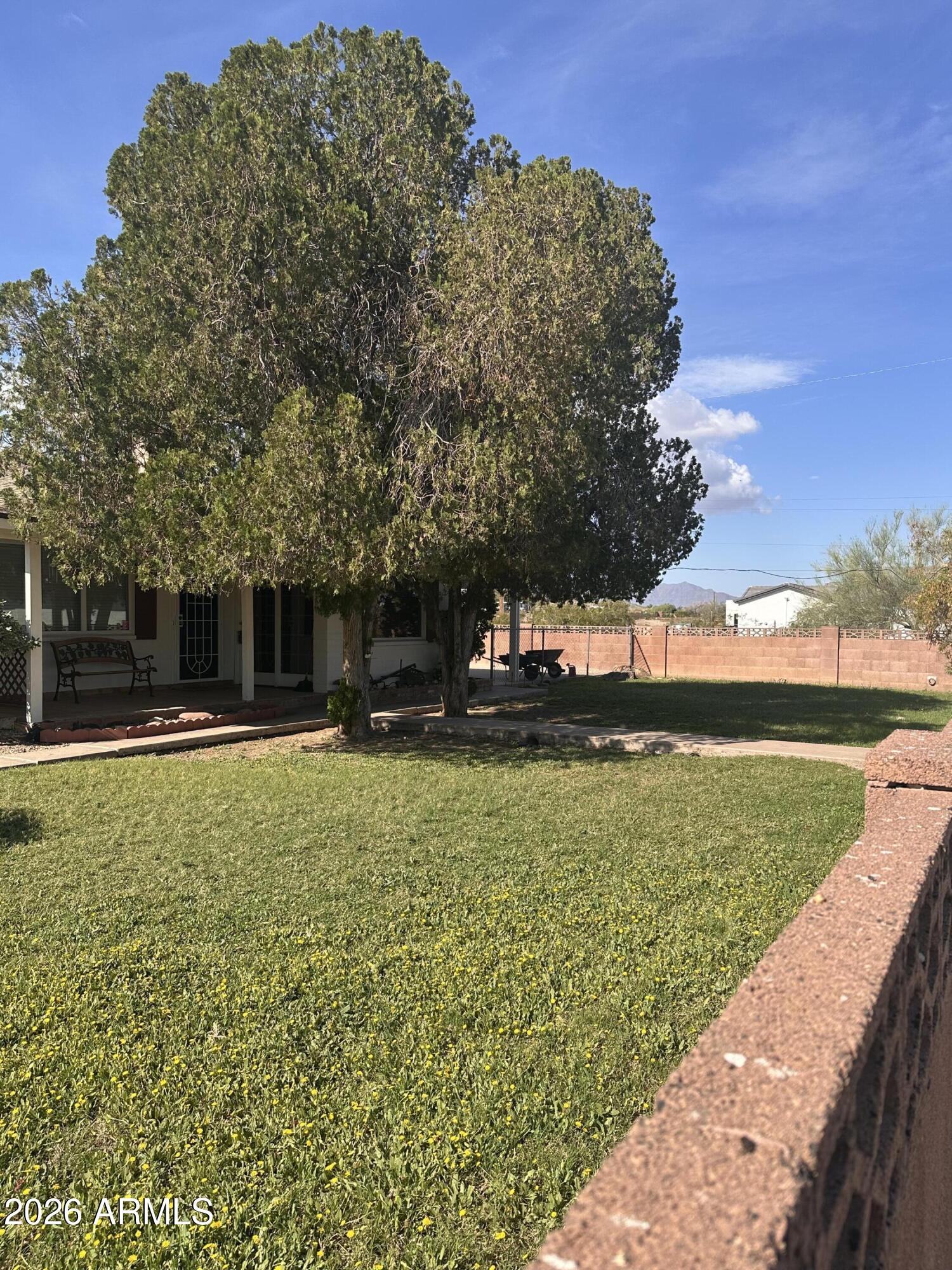 2821 West Elliot Road Laveen, AZ 85339 - Photo 72 of 92 a front view of a house with a yard