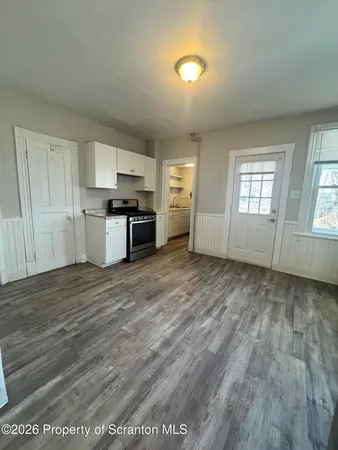 a view of a kitchen with microwave and stove