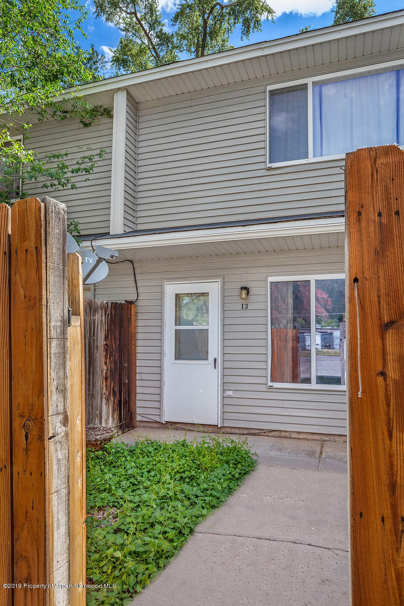 323 Park Avenue, Unit I3 Basalt, CO 81621 - Photo 1 of 10 a front view of a house with a garden