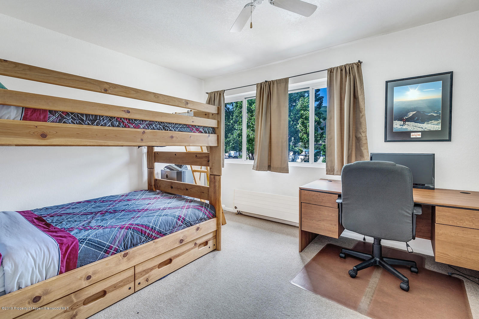 323 Park Avenue, Unit I3 Basalt, CO 81621 - Photo 6 of 10 a bedroom with a bed and a desk