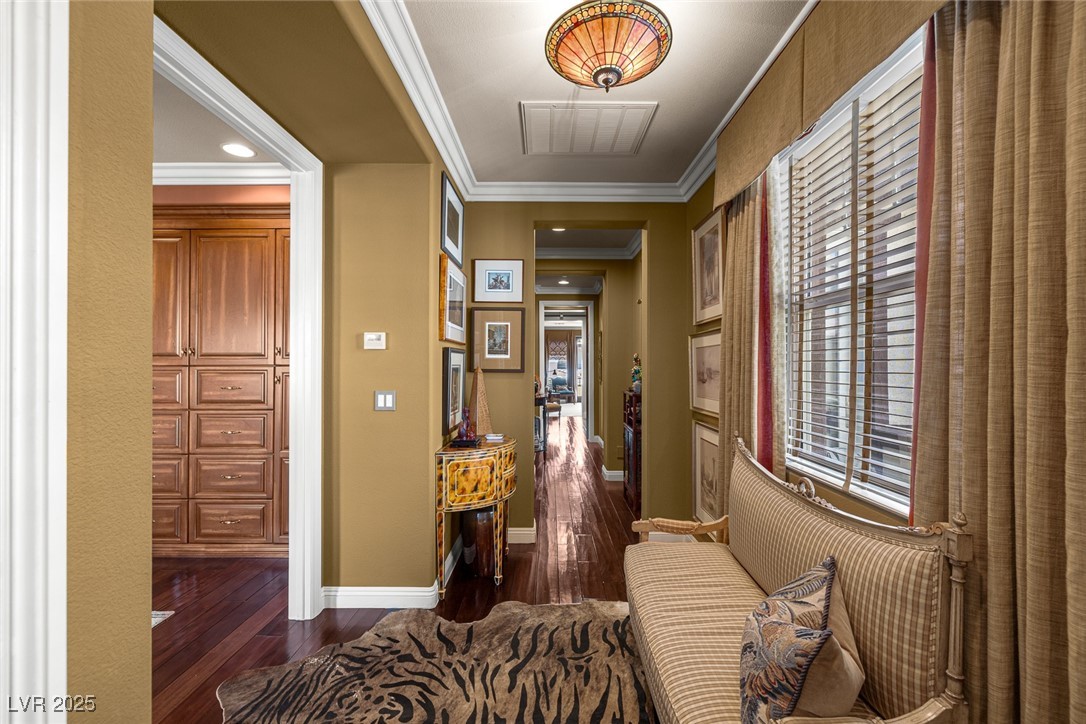 11280 Granite Ridge Drive, Unit 1057 Las Vegas, NV 89135 - Photo 22 of 46 Corridor with ornamental molding, dark wood finished floors, and recessed lighting