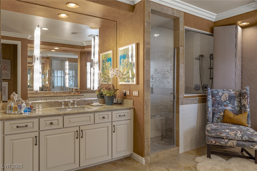 11280 Granite Ridge Drive, Unit 1057 Las Vegas, NV 89135 - Photo 26 of 46 Full bathroom featuring ornamental molding, vanity, a shower stall, and recessed lighting