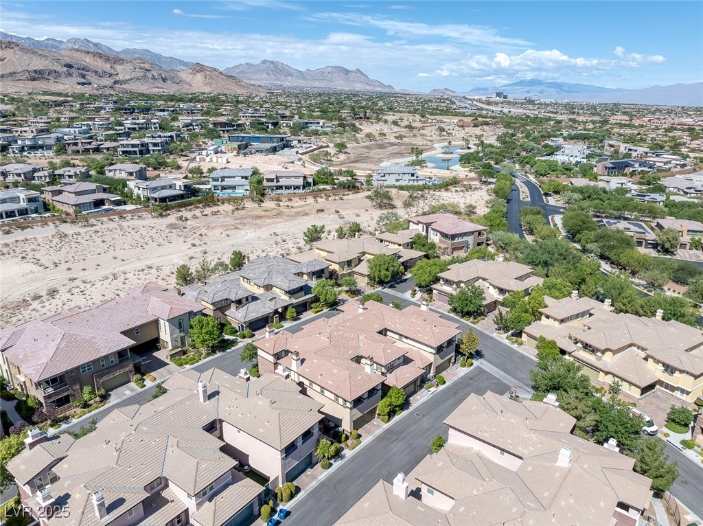 11280 Granite Ridge Drive, Unit 1057 Las Vegas, NV 89135 - Photo 34 of 46 Aerial perspective of suburban area featuring a mountain backdrop