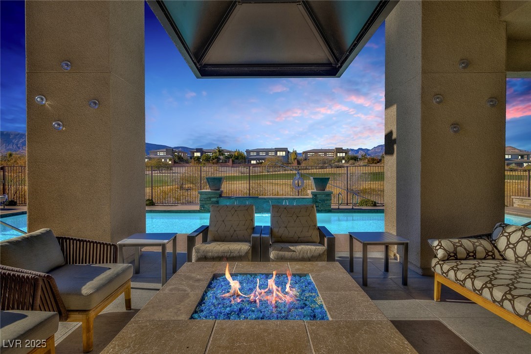 11280 Granite Ridge Drive, Unit 1057 Las Vegas, NV 89135 - Photo 38 of 46 Patio terrace at dusk with a patio area