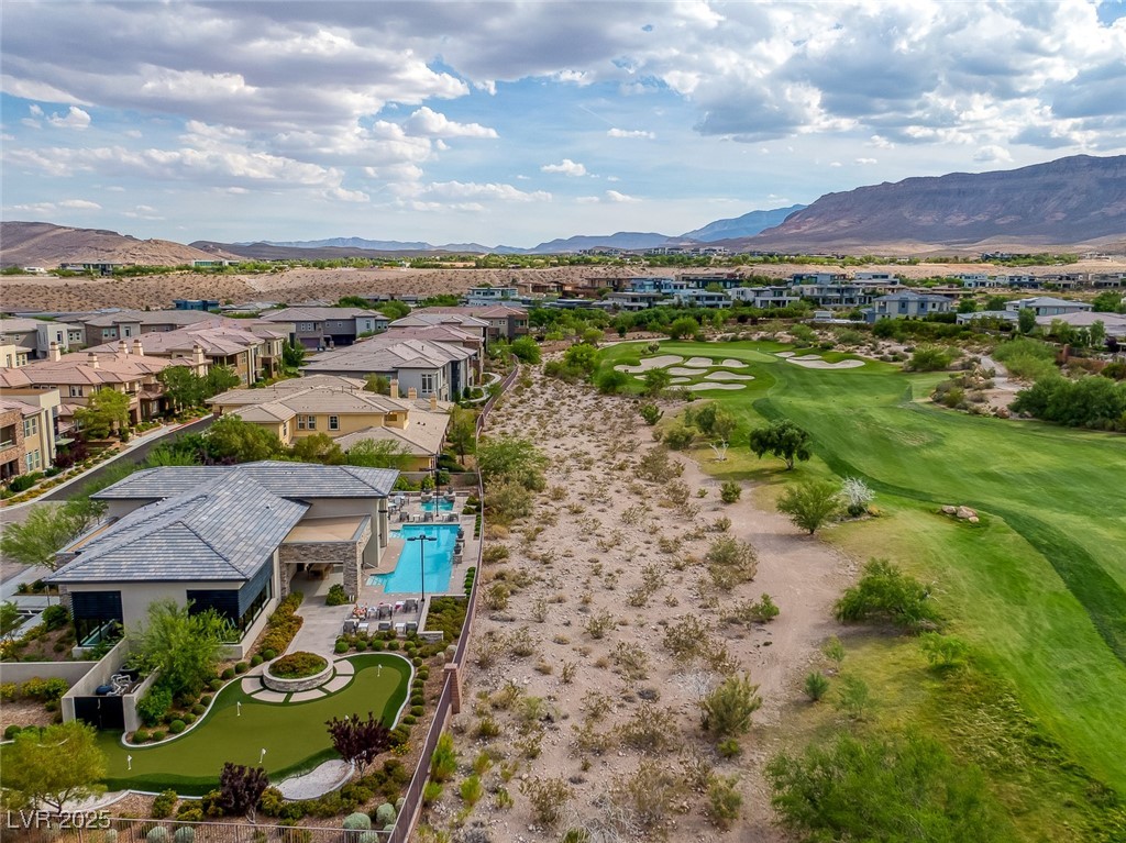 11280 Granite Ridge Drive, Unit 1057 Las Vegas, NV 89135 - Photo 41 of 46 Aerial perspective of suburban area with a mountainous background