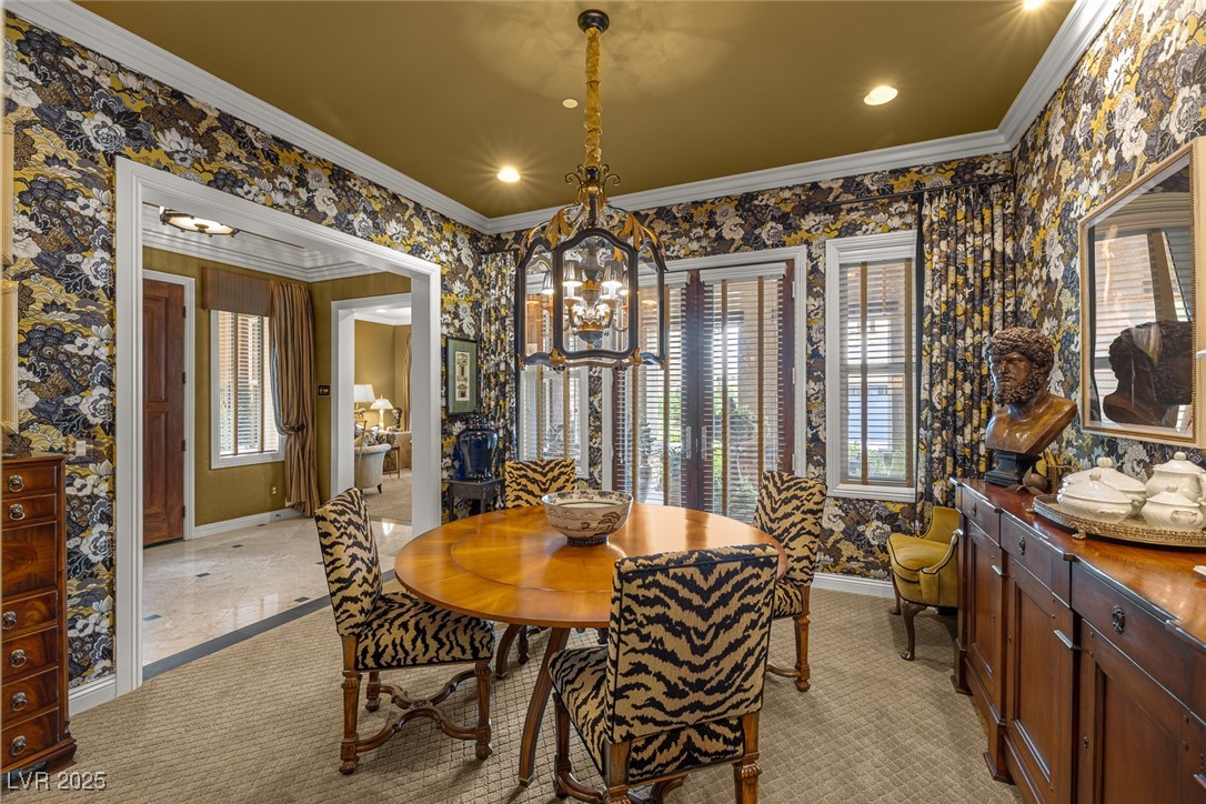 11280 Granite Ridge Drive, Unit 1057 Las Vegas, NV 89135 - Photo 5 of 46 Dining space featuring wallpapered walls, crown molding, light colored carpet, a chandelier, and recessed lighting