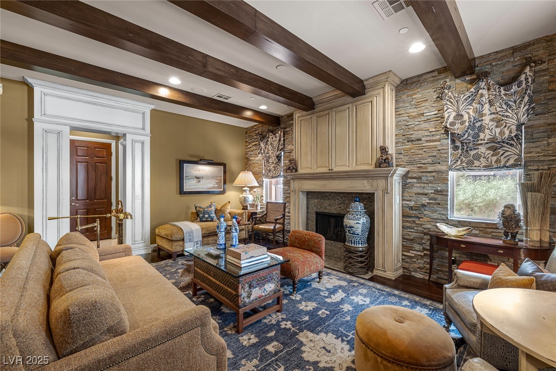 11280 Granite Ridge Drive, Unit 1057 Las Vegas, NV 89135 - Photo 9 of 46 Living room featuring beam ceiling, wood finished floors, a premium fireplace, and recessed lighting