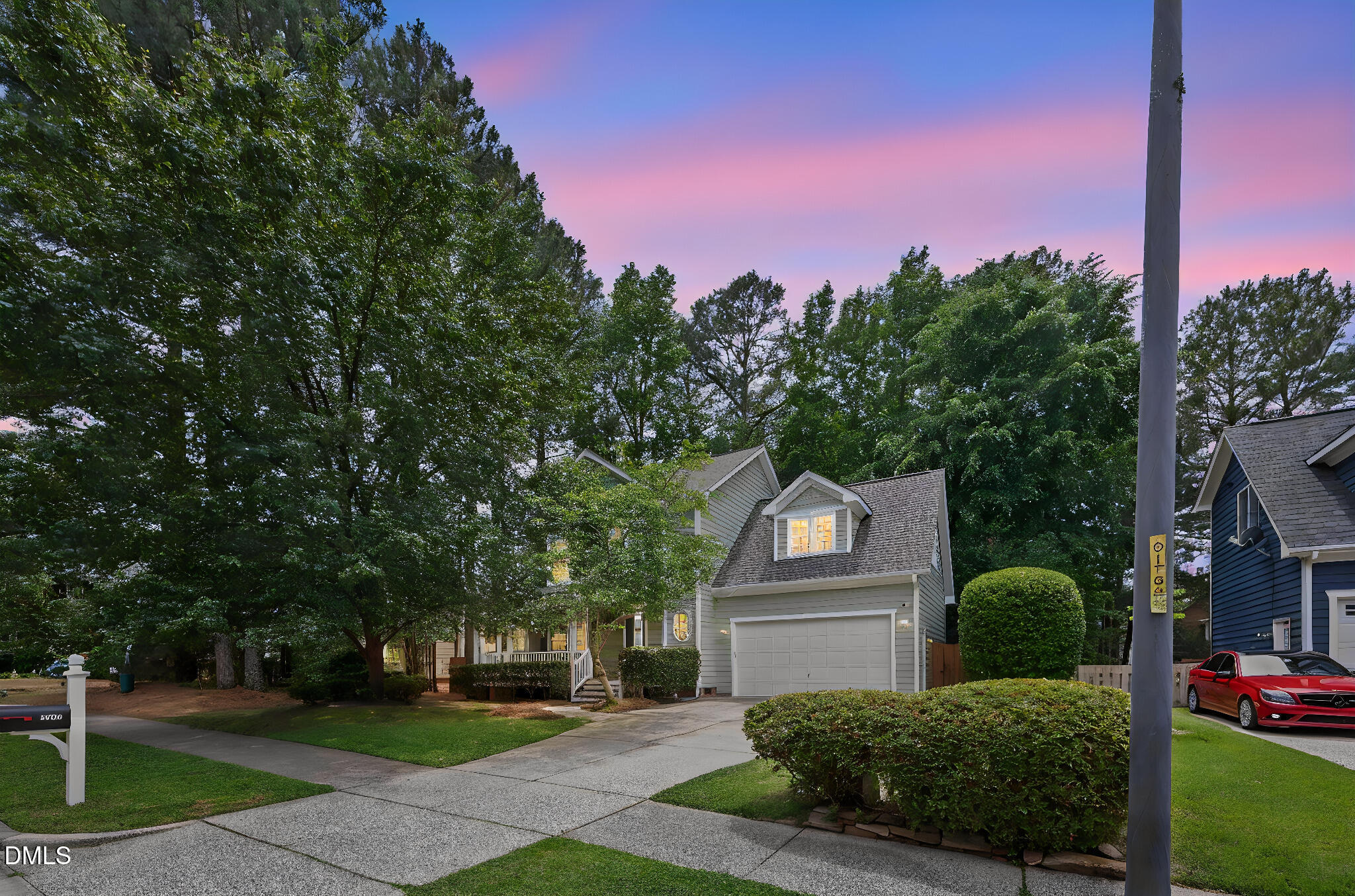 1008 Scotts Ridge Trail Apex, NC 27502 - Photo 2 of 57 a view of a garden with plants and large trees