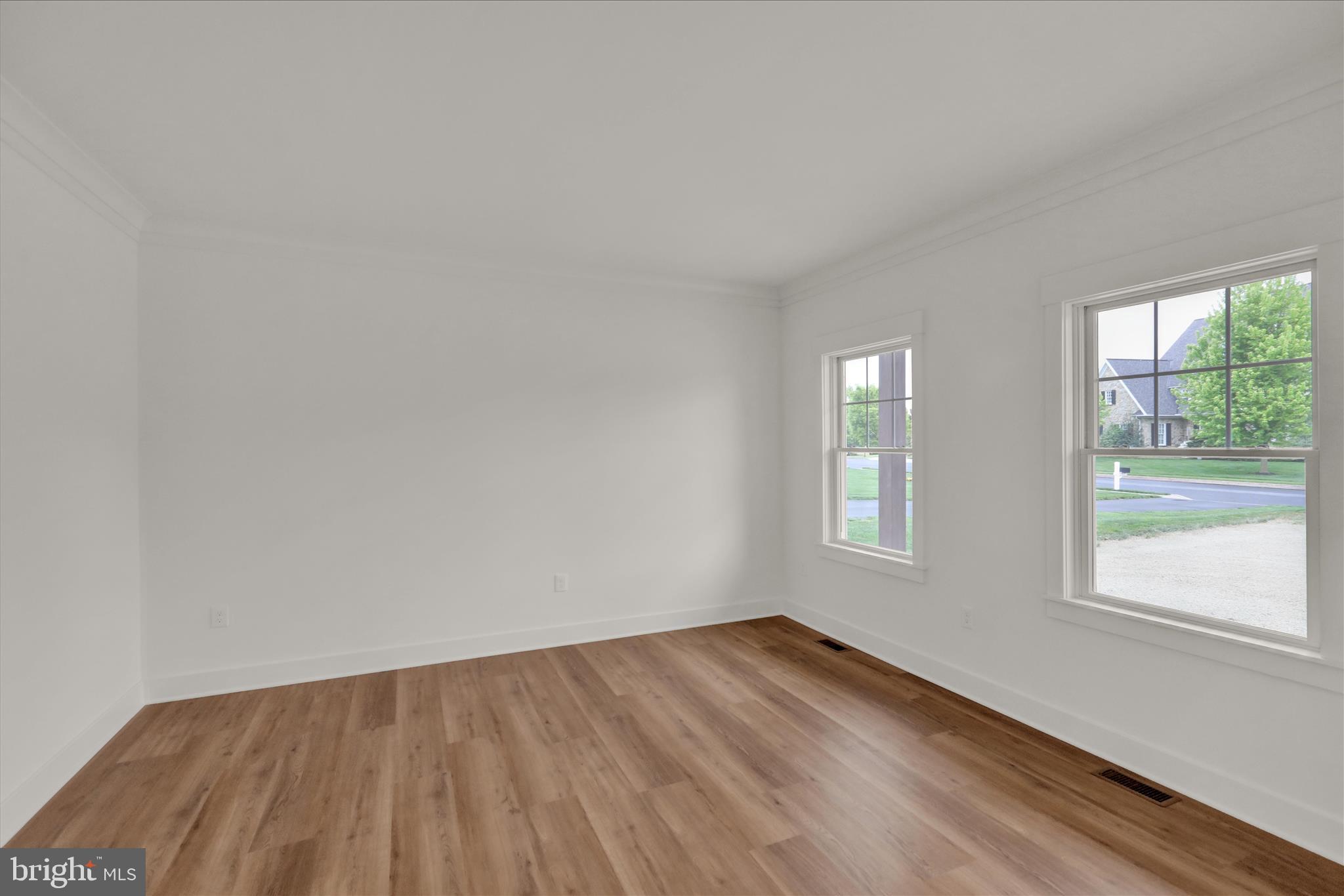 513 Cheltenham Court Lititz, PA 17543 - Photo 31 of 64 an empty room with wooden floor and windows
