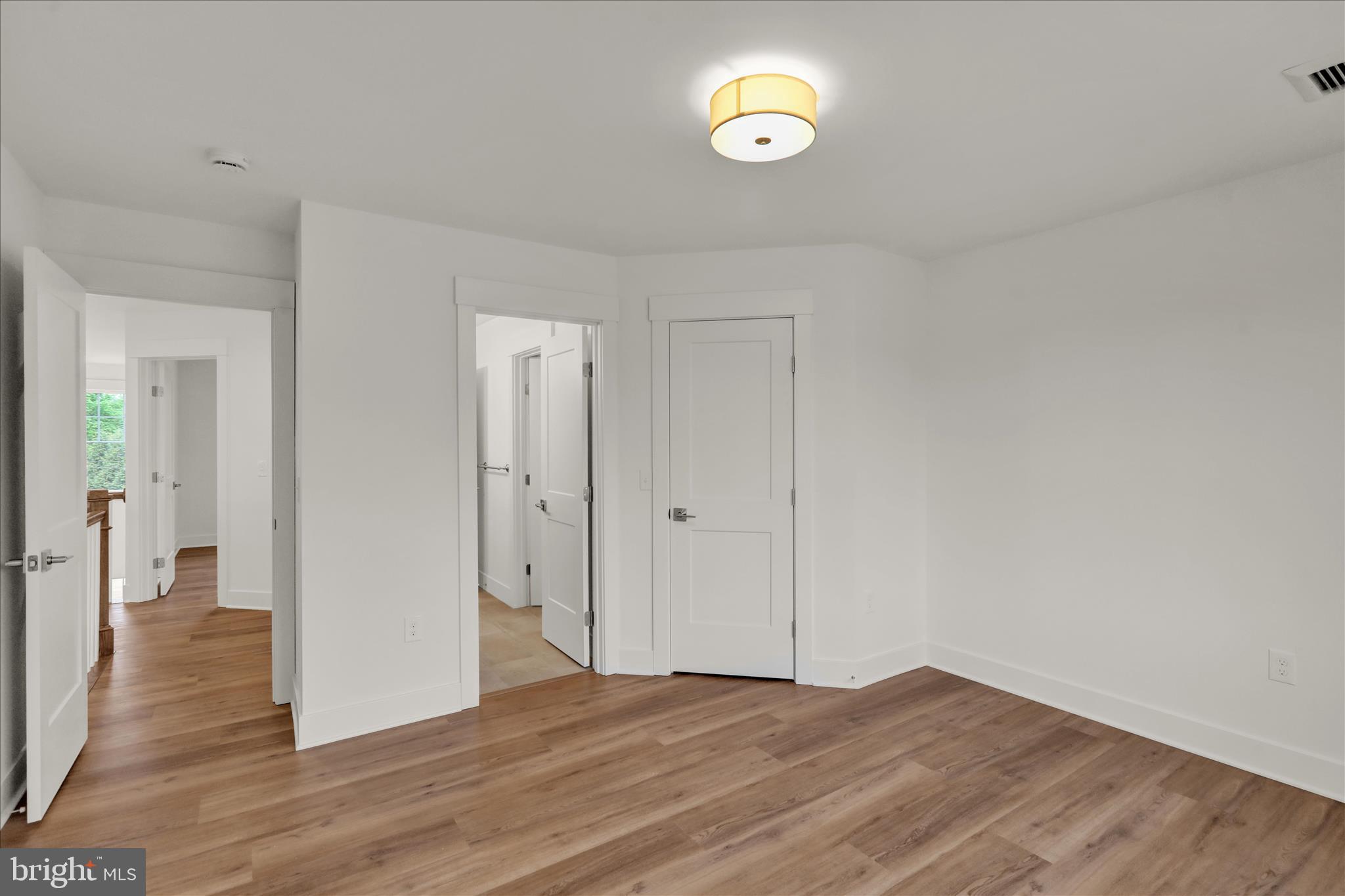 513 Cheltenham Court Lititz, PA 17543 - Photo 53 of 64 a view of an empty room with wooden floor and a window