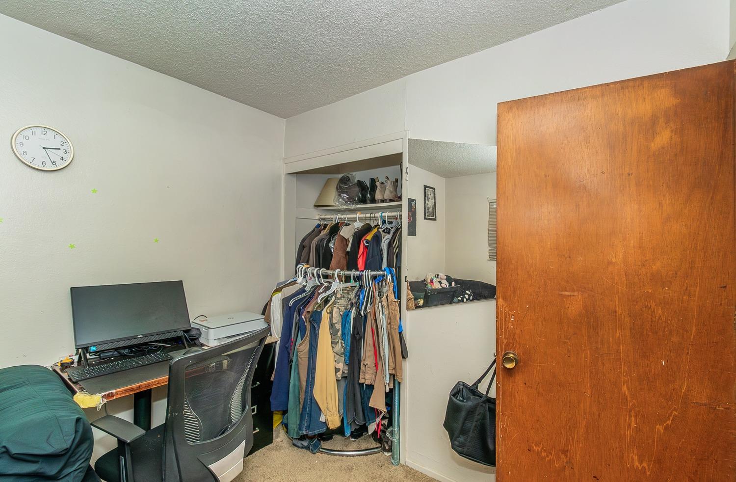 922 Music Avenue Clovis, CA 93612 - Photo 13 of 20 a view of a room with gym equipment