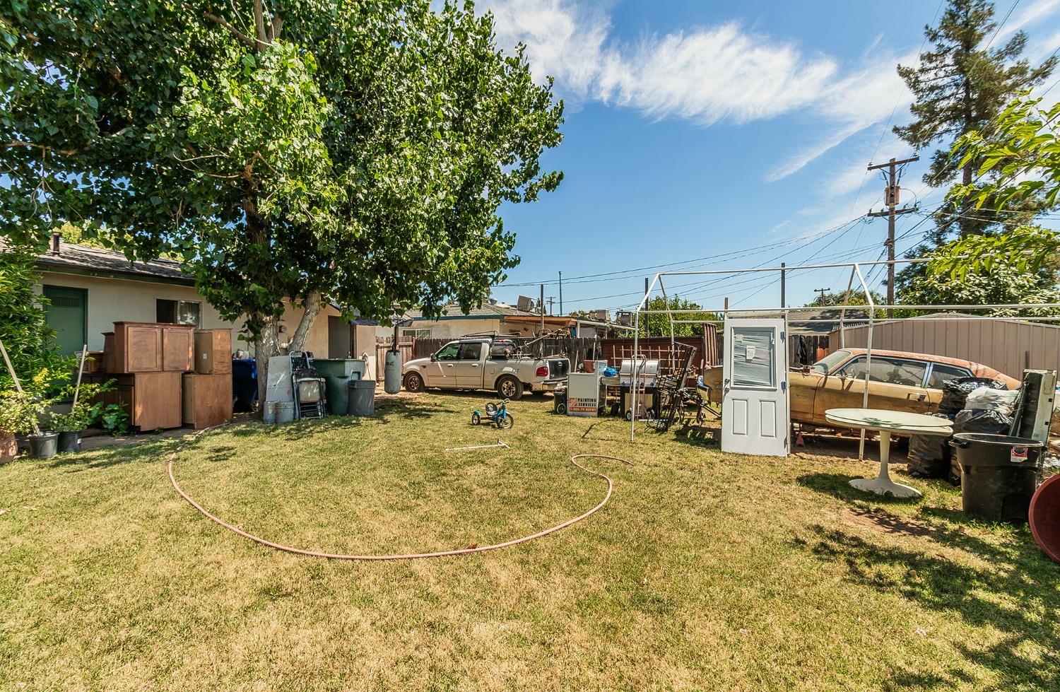 922 Music Avenue Clovis, CA 93612 - Photo 16 of 20 a view of a backyard with parked area