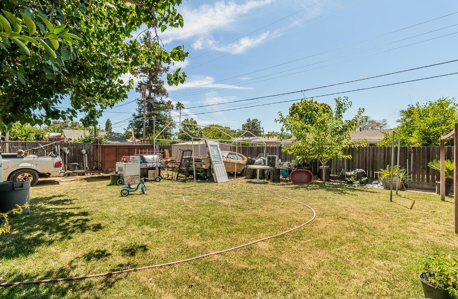 922 Music Avenue Clovis, CA 93612 - Photo 17 of 20 a swimming pool with outdoor seating and yard