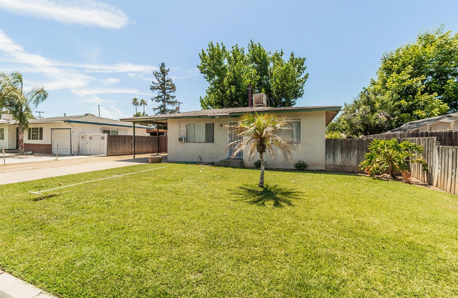 922 Music Avenue Clovis, CA 93612 - Photo 20 of 20 a swimming pool with some trees in the background