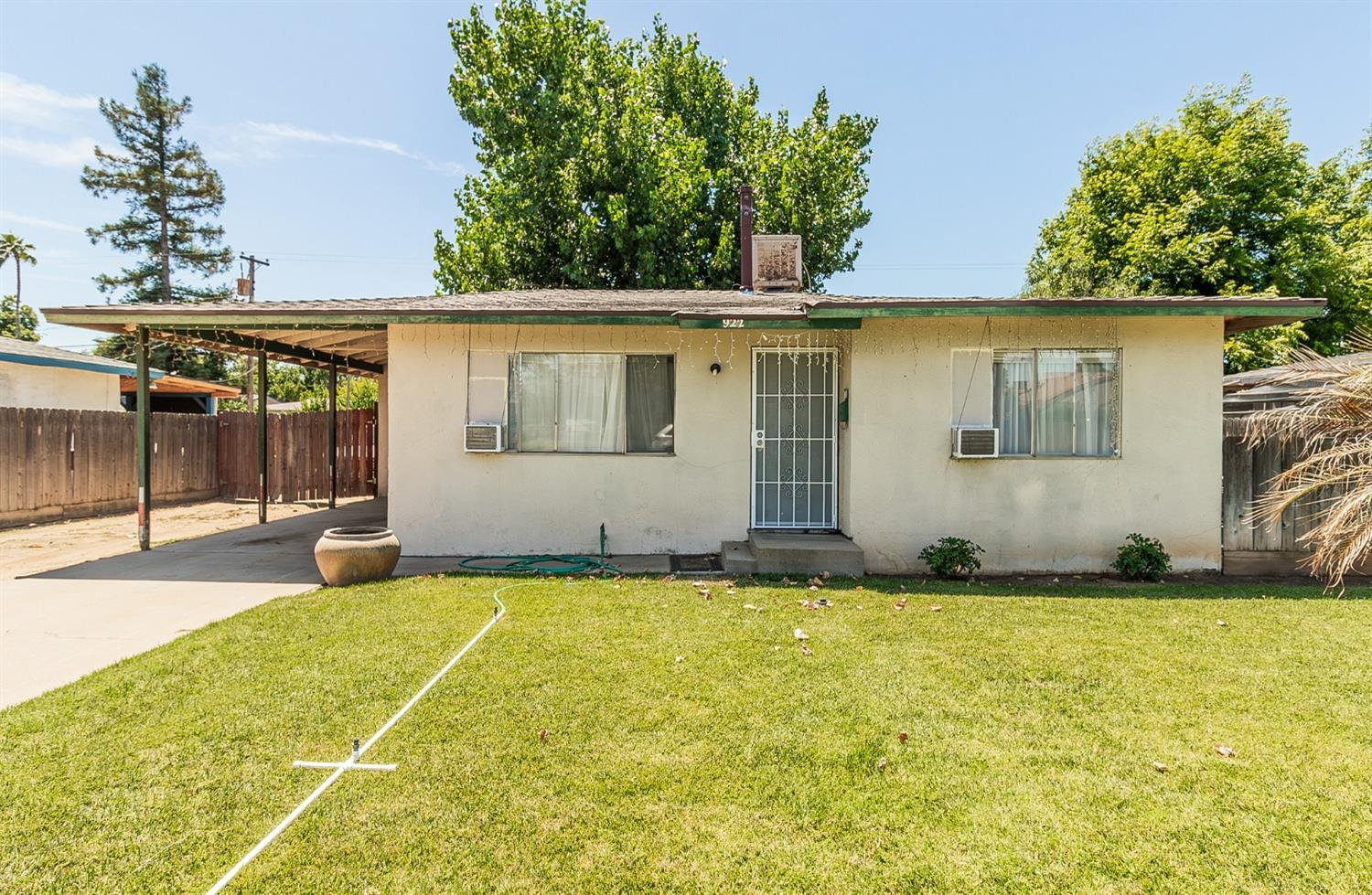 922 Music Avenue Clovis, CA 93612 - Photo 2 of 20 a backyard of a house with table and chairs