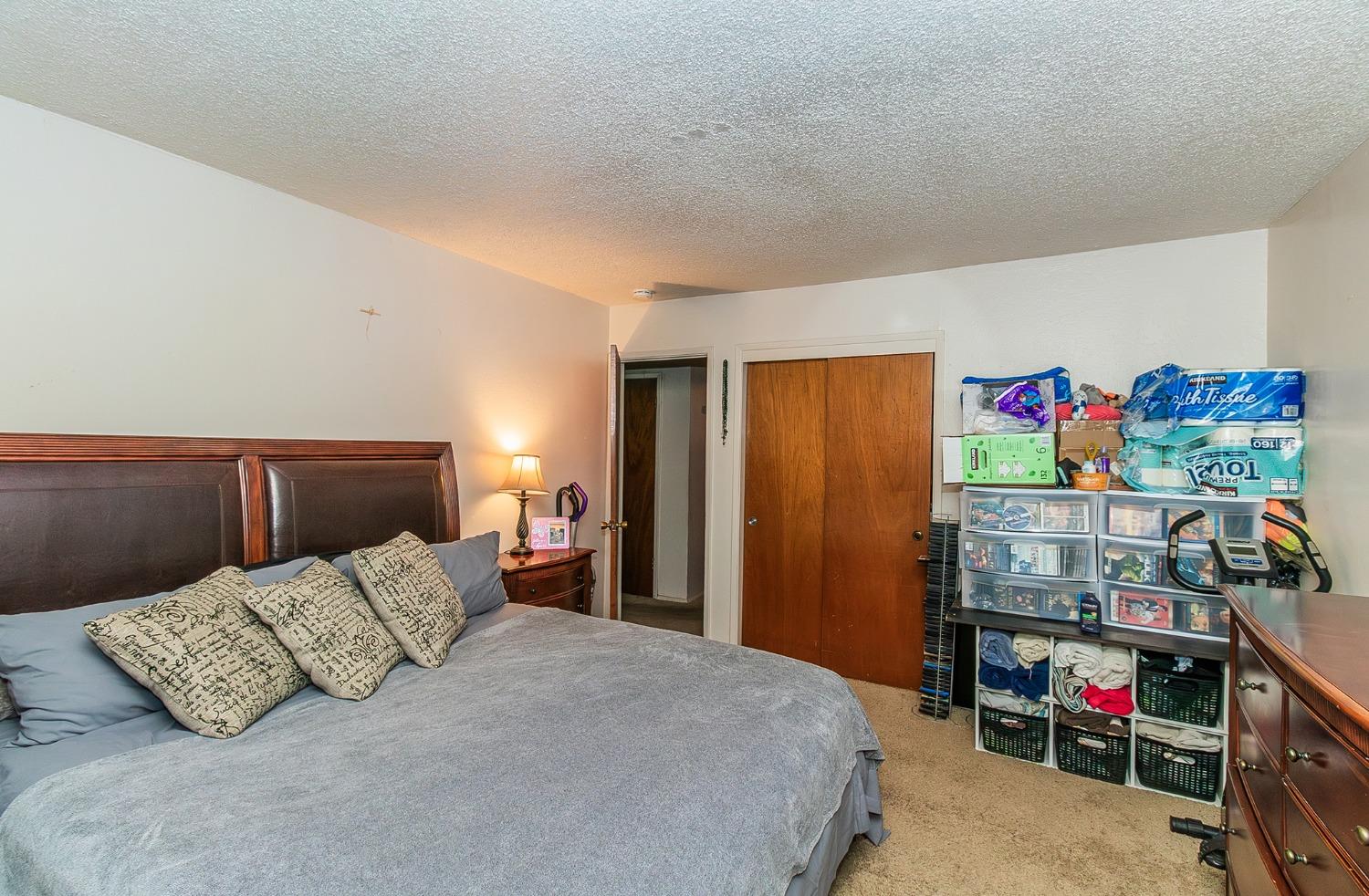 922 Music Avenue Clovis, CA 93612 - Photo 10 of 20 a bedroom with a bed and a window