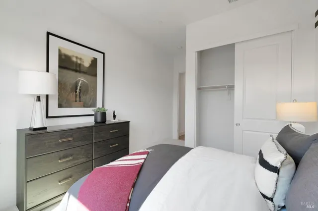 a bedroom with a bed and a dresser