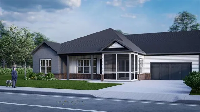 a front view of a house with a yard and potted plants