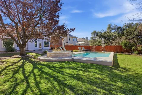 a view of a house with a big yard