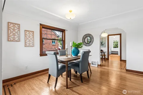 a view of a dining room with furniture window and wooden floor