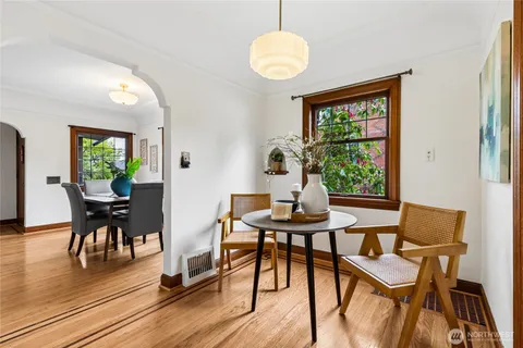 a kitchen with stainless steel appliances a stove a sink and a wooden floors