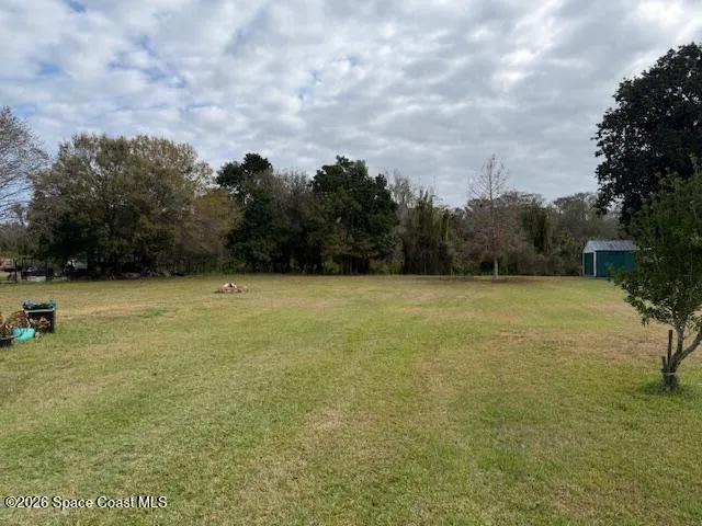 a view of a outdoor space and basketball court