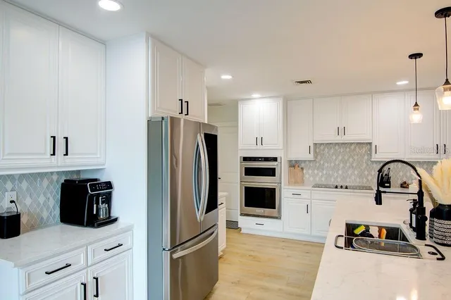 a bathroom with a sink and mirror