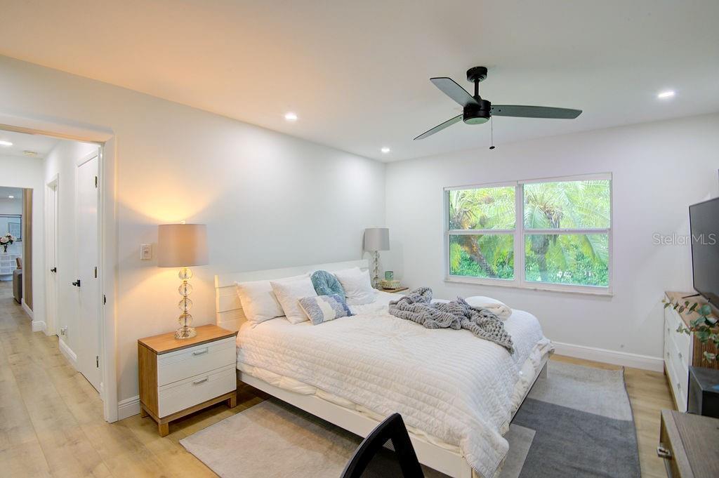 1720 Spring Creek Drive Sarasota, FL 34239 - Photo 25 of 63 a bedroom with a bed and a window